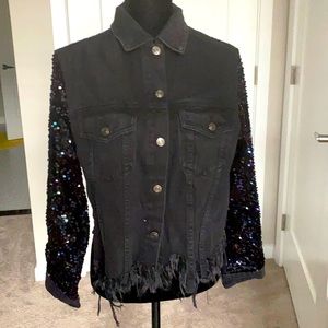 Washed black jean jacket with sparkly sleeves